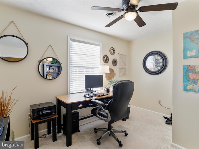 office with visible vents, baseboards, a ceiling fan, and carpet floors
