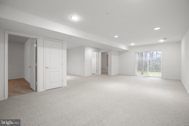 below grade area featuring baseboards, carpet floors, and recessed lighting