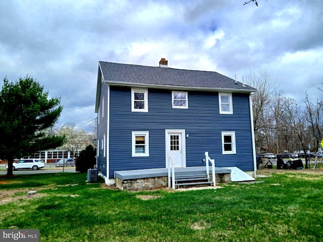 55 N Main St, New Egypt, NJ 08533 - back of property with cooling unit, a chimney, and a lawn