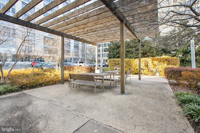 view of patio / terrace with a pergola and outdoor dining area