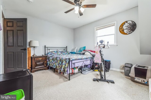 bedroom with carpet, baseboards, and ceiling fan