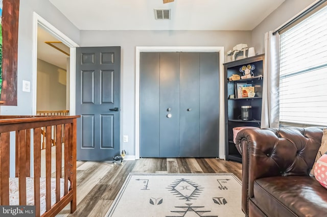 interior space featuring wood finished floors and visible vents