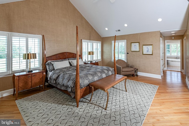 bedroom with wallpapered walls, wood finished floors, baseboards, high vaulted ceiling, and recessed lighting