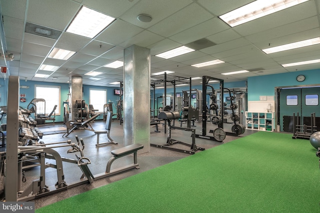 workout area featuring a drop ceiling