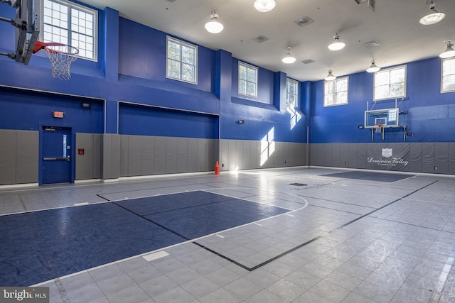view of sport court with community basketball court and plenty of natural light