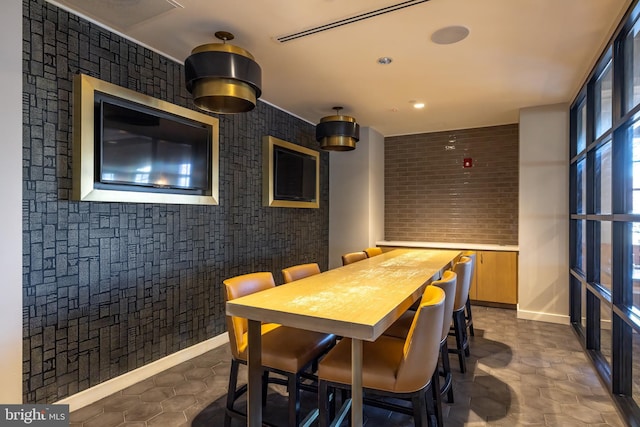 dining room with plenty of natural light and baseboards