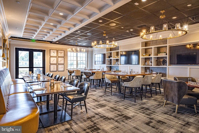 carpeted dining area featuring a chandelier, crown molding, healthy amount of natural light, and coffered ceiling