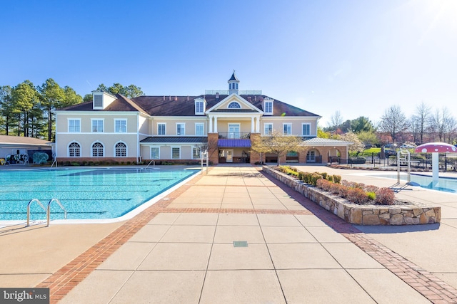 community pool featuring a patio area