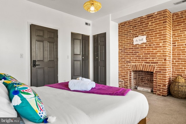 bedroom with visible vents, a closet, and carpet