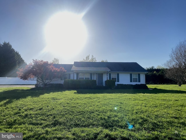 ranch-style house featuring a front lawn