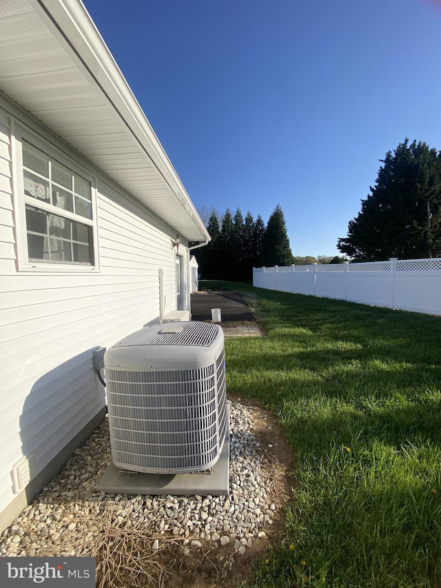 exterior details featuring fence and central air condition unit