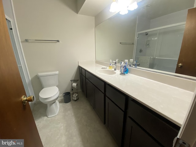 bathroom featuring toilet, concrete flooring, a shower stall, and vanity