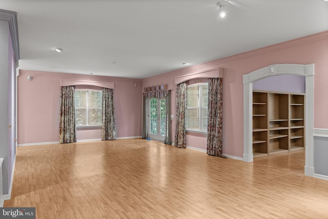 4 Tara Ln, Delran, NJ 08075 - empty room with light wood finished floors, ornamental molding, baseboards, and arched walkways