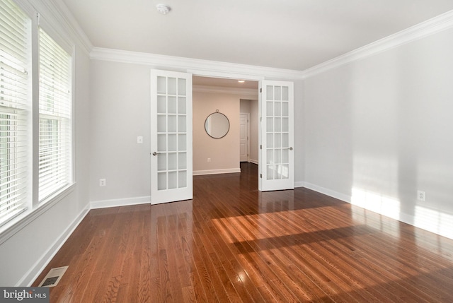 unfurnished room featuring visible vents, ornamental molding, and french doors