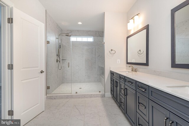 full bathroom featuring a shower stall, marble finish floor, a sink, and double vanity
