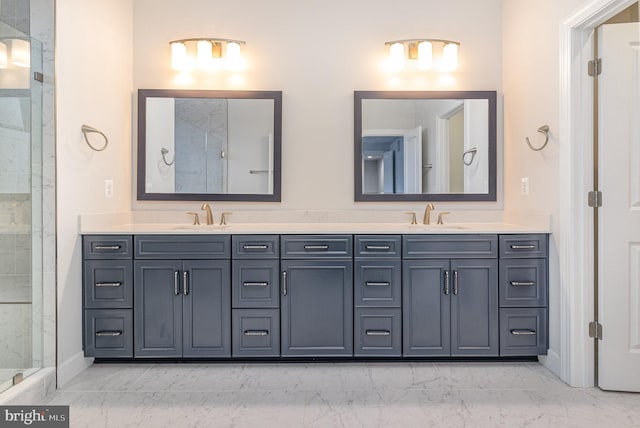 full bath featuring a tile shower, marble finish floor, and a sink