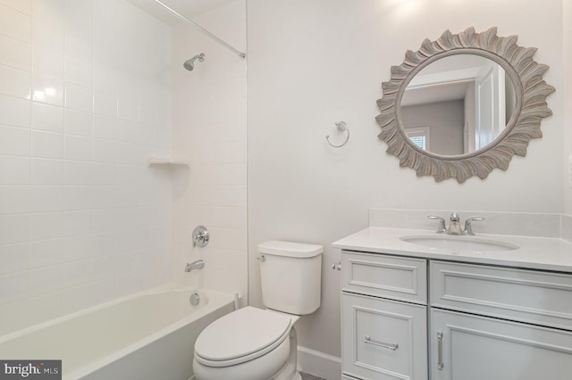 bathroom featuring baseboards, vanity, shower / tub combination, and toilet