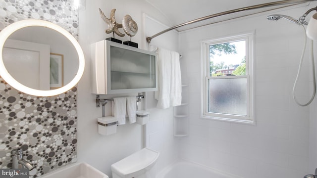full bathroom with a sink and shower / washtub combination
