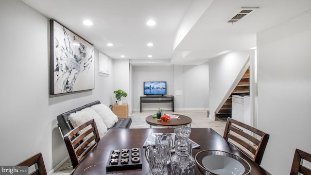 dining area featuring visible vents, stairs, baseboards, recessed lighting, and light wood finished floors