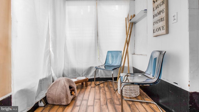 living area with hardwood / wood-style flooring