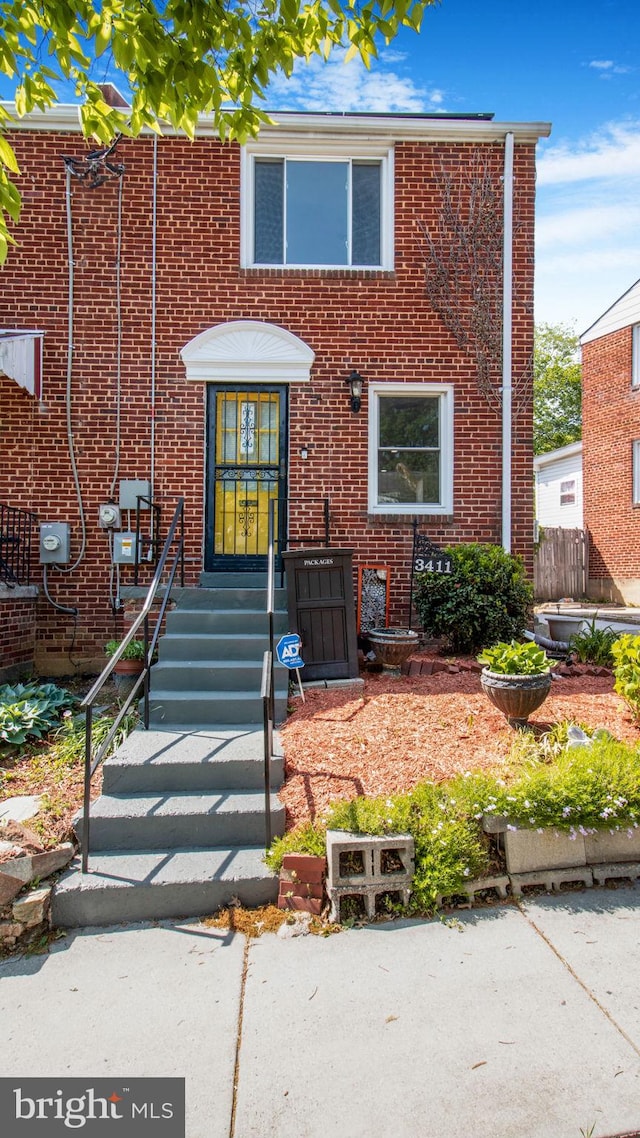 view of front of property featuring brick siding