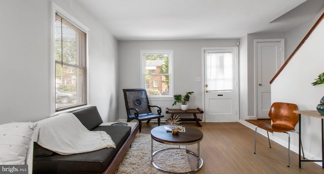 sitting room featuring baseboards and wood finished floors