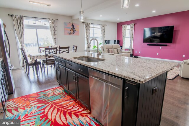 15 N Tompkins Sq, Downingtown, PA 19335 - kitchen with a sink, wood finished floors, appliances with stainless steel finishes, and open floor plan