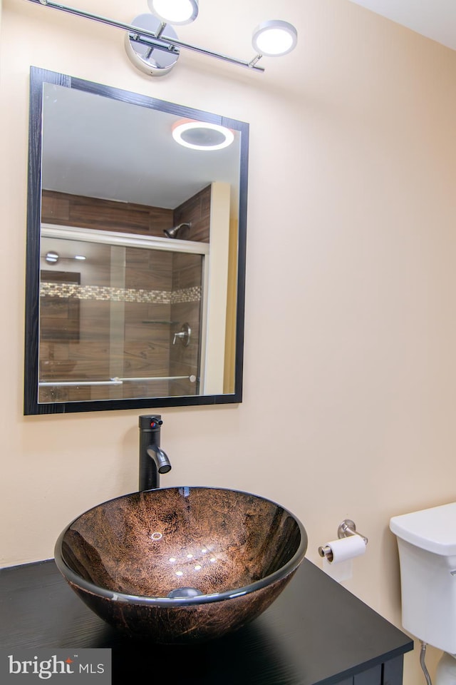 15 N Tompkins Sq, Downingtown, PA 19335 - bathroom featuring a tile shower and a sink
