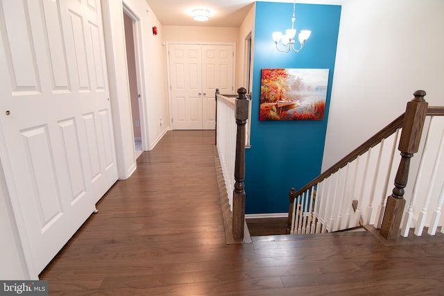 15 N Tompkins Sq, Downingtown, PA 19335 - hall with baseboards, a notable chandelier, and dark wood finished floors