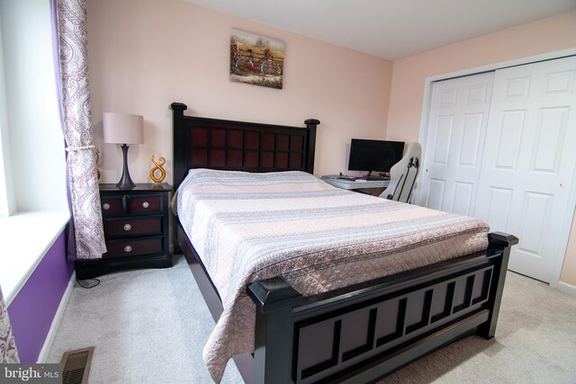 15 N Tompkins Sq, Downingtown, PA 19335 - bedroom featuring baseboards, visible vents, light carpet, and a closet