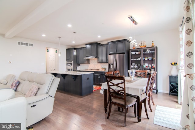 15 N Tompkins Sq, Downingtown, PA 19335 - dining area featuring visible vents, baseboards, beamed ceiling, recessed lighting, and wood finished floors