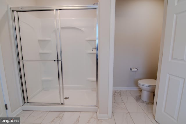 15 N Tompkins Sq, Downingtown, PA 19335 - bathroom with marble finish floor, a stall shower, toilet, and baseboards