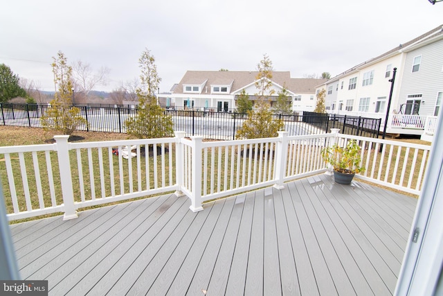 15 N Tompkins Sq, Downingtown, PA 19335 - wooden terrace featuring a yard, fence, and a residential view