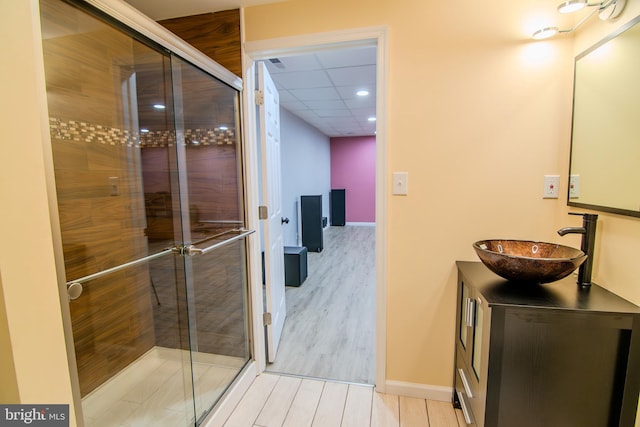 15 N Tompkins Sq, Downingtown, PA 19335 - bathroom with vanity, a shower stall, wood finished floors, and baseboards