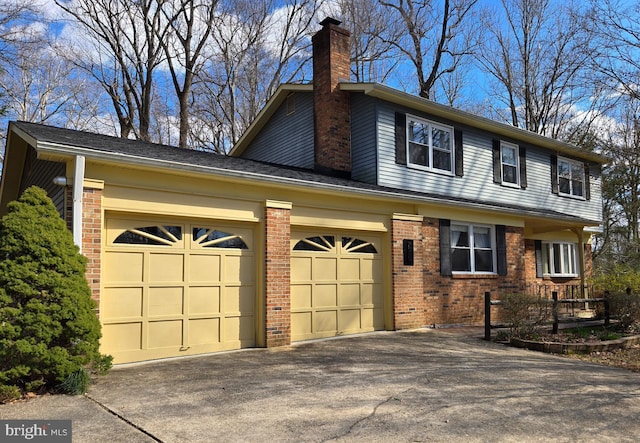 3360 Ben Oak Dr, Huntingtown, MD 20639 - view of front of house with brick siding, concrete driveway, an attached garage, and a chimney