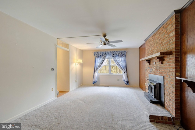 3360 Ben Oak Dr, Huntingtown, MD 20639 - unfurnished living room with a wood stove, carpet floors, baseboards, and a ceiling fan