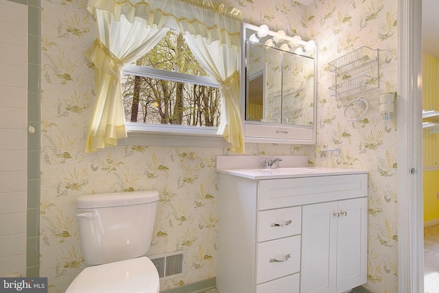 3360 Ben Oak Dr, Huntingtown, MD 20639 - bathroom featuring wallpapered walls, vanity, toilet, and visible vents