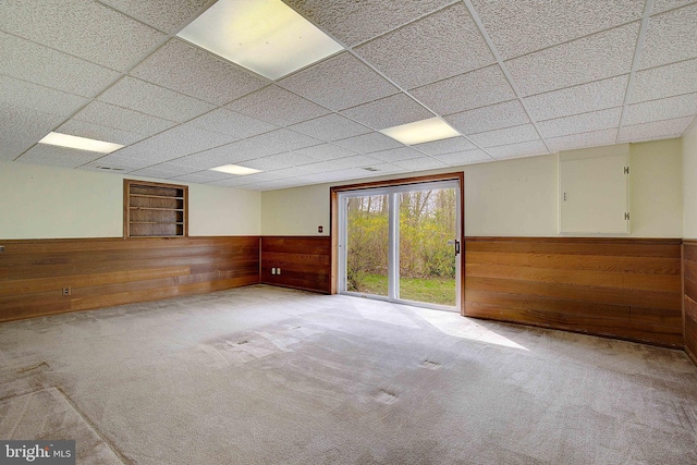 3360 Ben Oak Dr, Huntingtown, MD 20639 - unfurnished room with wainscoting, wood walls, and carpet flooring