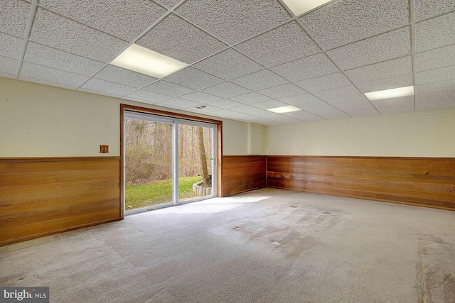 3360 Ben Oak Dr, Huntingtown, MD 20639 - unfurnished room featuring carpet flooring, wood walls, a drop ceiling, and wainscoting