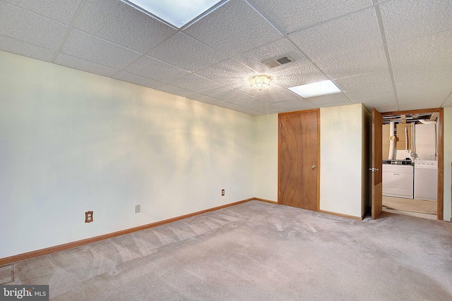 3360 Ben Oak Dr, Huntingtown, MD 20639 - finished below grade area with carpet flooring, visible vents, baseboards, washer and dryer, and a paneled ceiling
