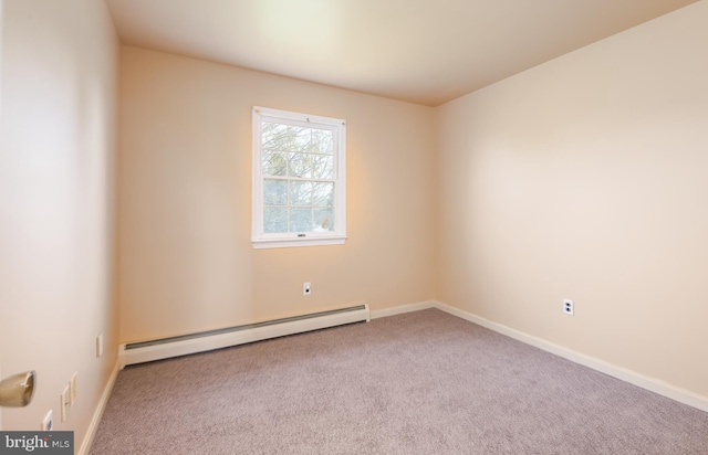 spare room with baseboards, carpet flooring, and baseboard heating