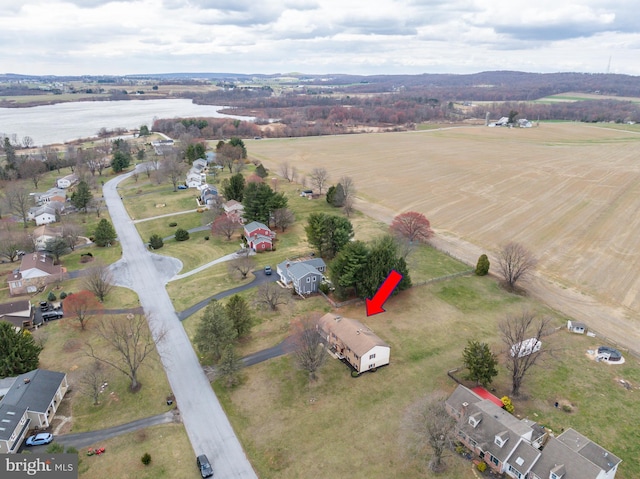 drone / aerial view with a water view and a rural view