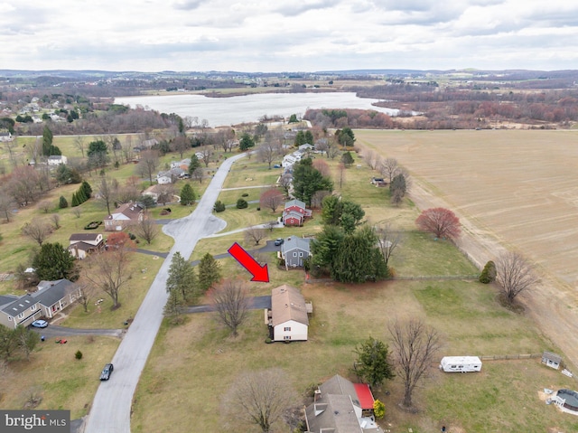 aerial view featuring a rural view and a water view