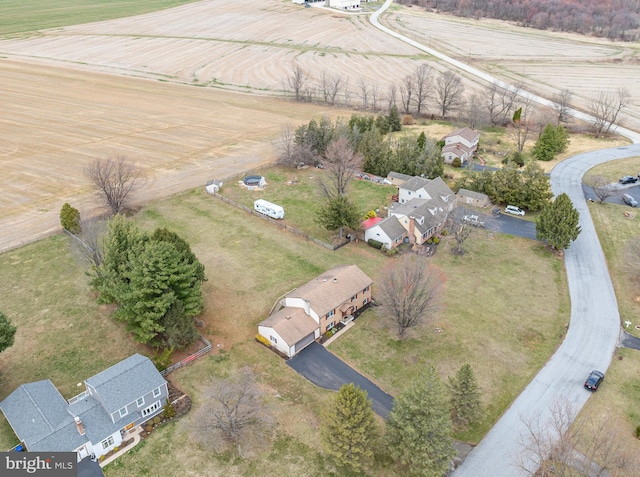 birds eye view of property with a rural view