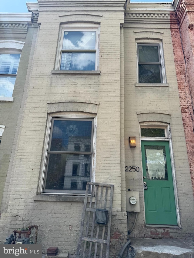 view of front of home with brick siding