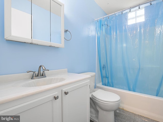 bathroom featuring vanity, shower / bath combo, and toilet