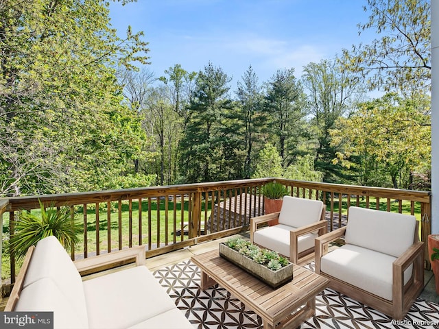 deck with a lawn and outdoor lounge area