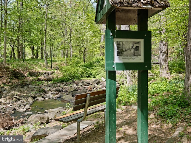 exterior details with a wooded view