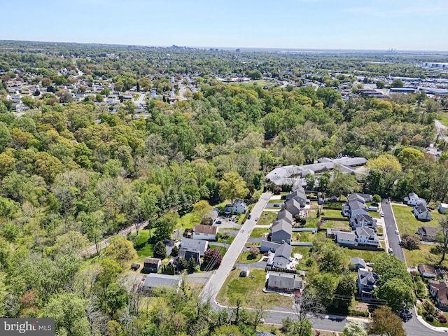 bird's eye view with a forest view and a residential view