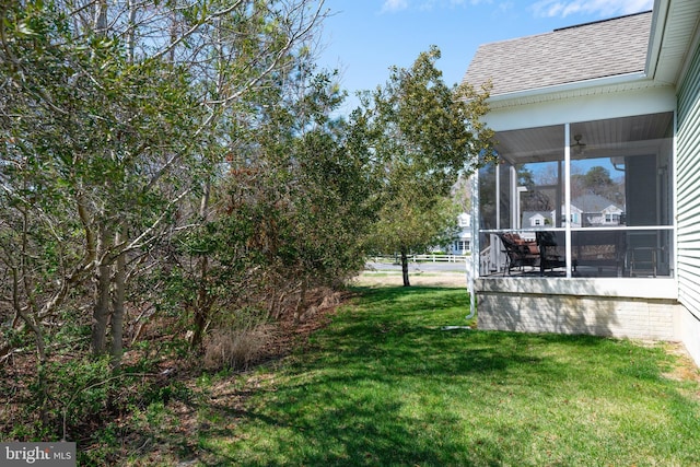 view of yard with a sunroom
